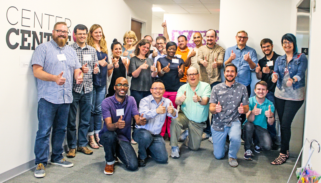Photo of 24 workshop attendees and Jared all giving a thumbs up together after two successful days.